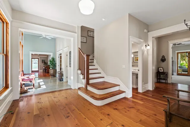 a view of a hallway with closet and a livingroom view