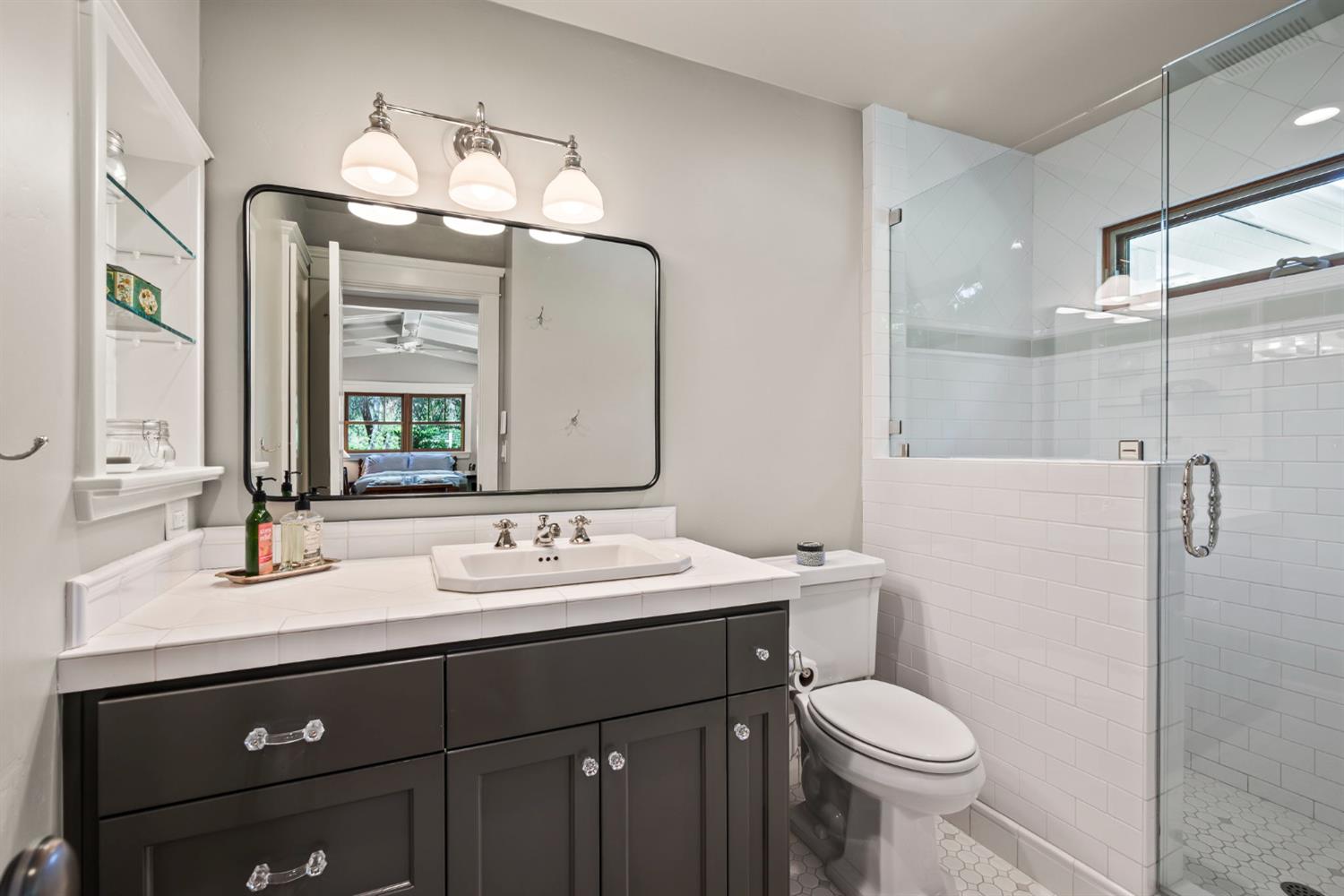 7407 Allen Lane Penryn, CA 95663 - Photo 43 of 83 a bathroom with a sink a toilet a mirror and shower