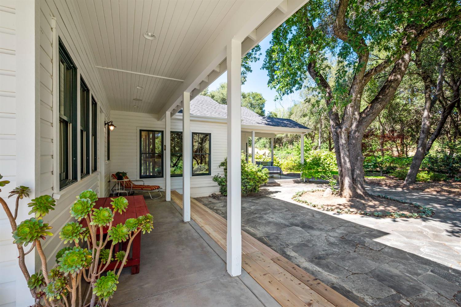 7407 Allen Lane Penryn, CA 95663 - Photo 62 of 83 a view of a patio with table and chairs next to a yard