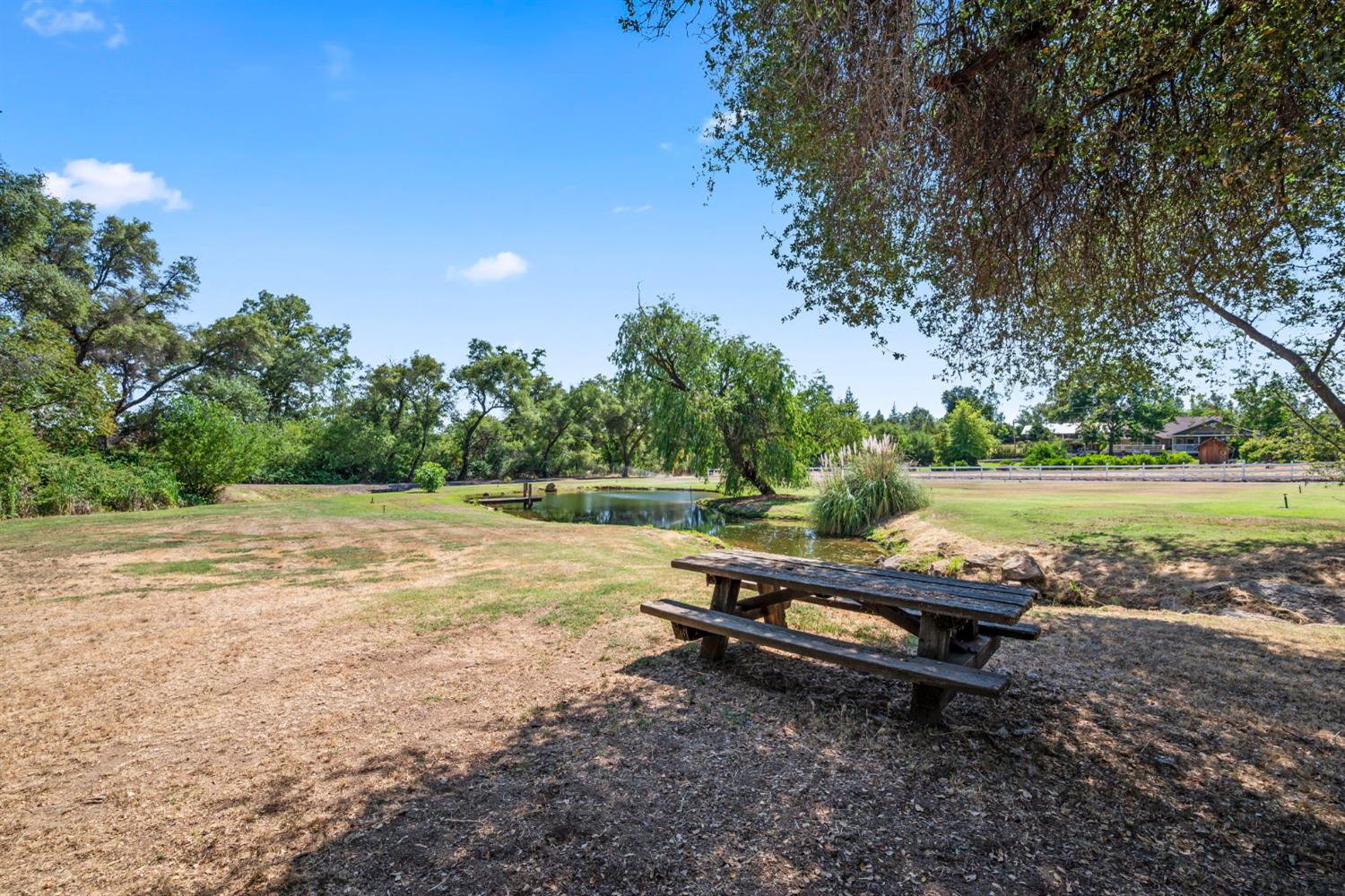 7407 Allen Lane Penryn, CA 95663 - Photo 65 of 83 a backyard of a house with trees and outdoor seating