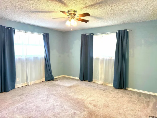 a view of a bedroom with a large window