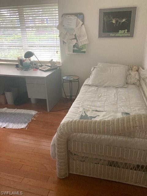 5150 Sand Dollar Lane Naples, FL 34103 - Photo 13 of 16 a bedroom with a bed and a window