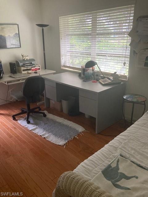 5150 Sand Dollar Lane Naples, FL 34103 - Photo 14 of 16 a bedroom with a bed and a desk