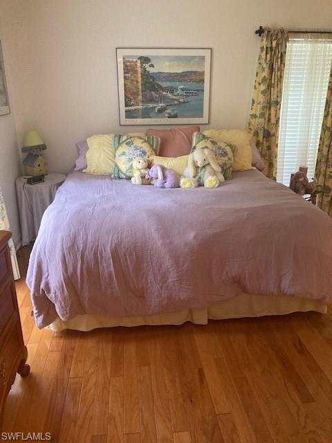 5150 Sand Dollar Lane Naples, FL 34103 - Photo 15 of 16 a bedroom with a bed and window