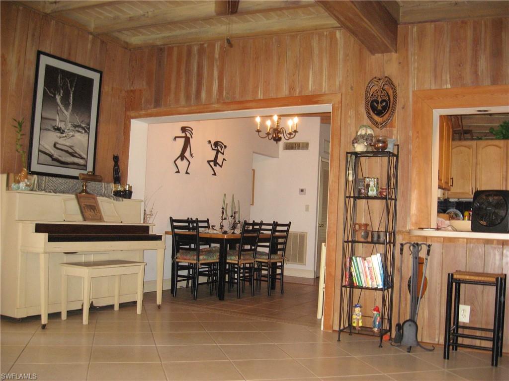 5150 Sand Dollar Lane Naples, FL 34103 - Photo 4 of 16 a view of a dining area with furniture