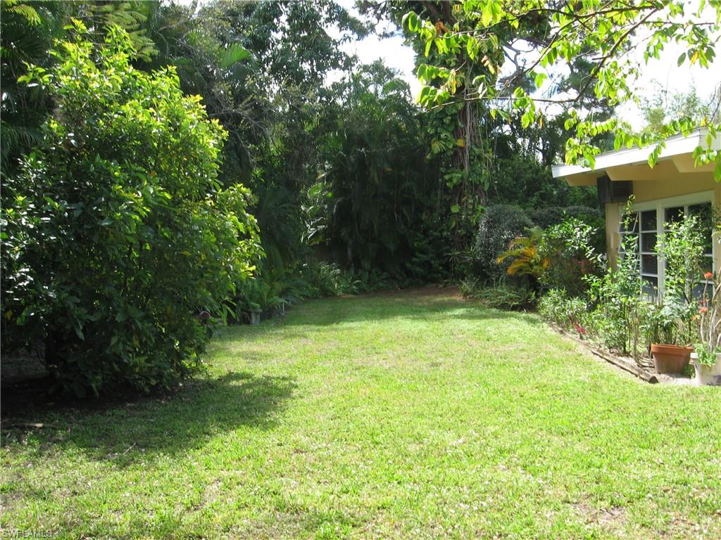 5150 Sand Dollar Lane Naples, FL 34103 - Photo 9 of 16 a view of an outdoor space and yard