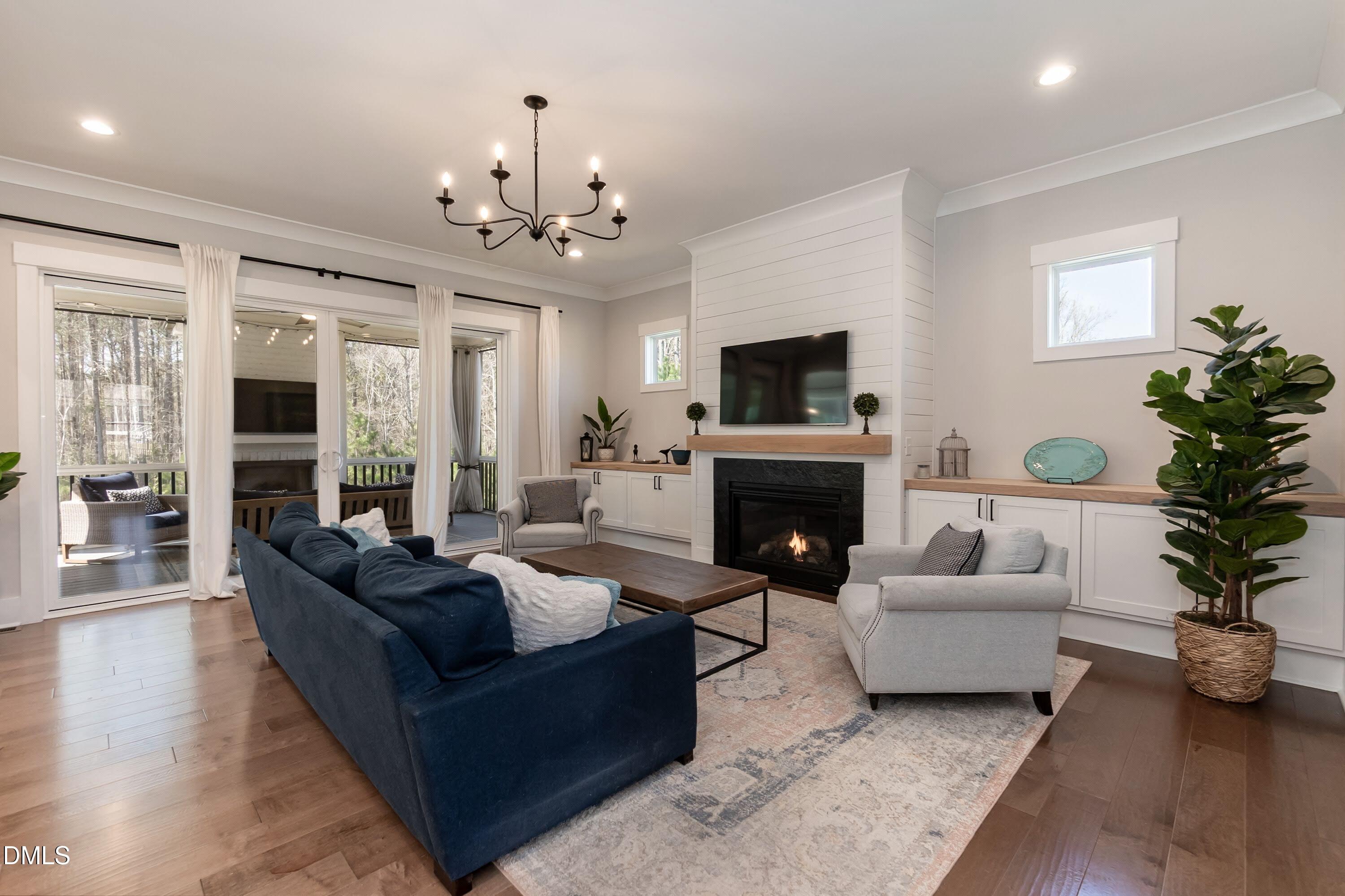 441 Bertram Valley Road Apex, NC 27523 - Photo 27 of 77 Large yet comfy family room with built in shelving