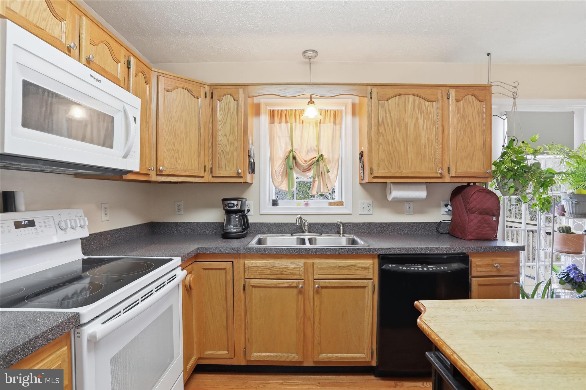 1158 Drummer Hill Road Front Royal, VA 22630 - Photo 13 of 36 a kitchen with a sink stove and cabinets