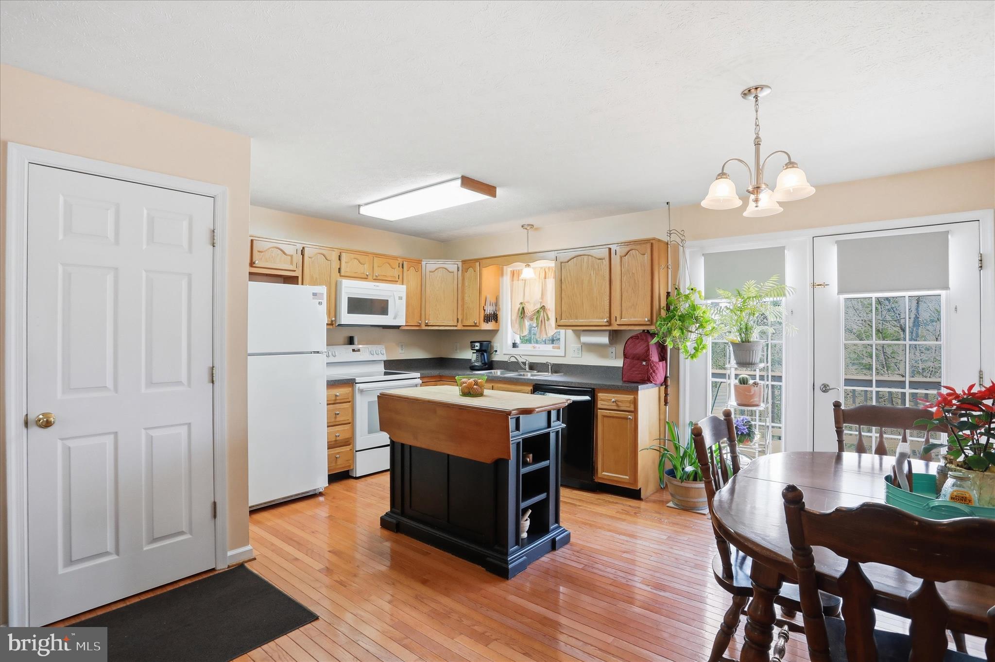 1158 Drummer Hill Road Front Royal, VA 22630 - Photo 36 of 36 a kitchen with stainless steel appliances granite countertop a stove and a refrigerator