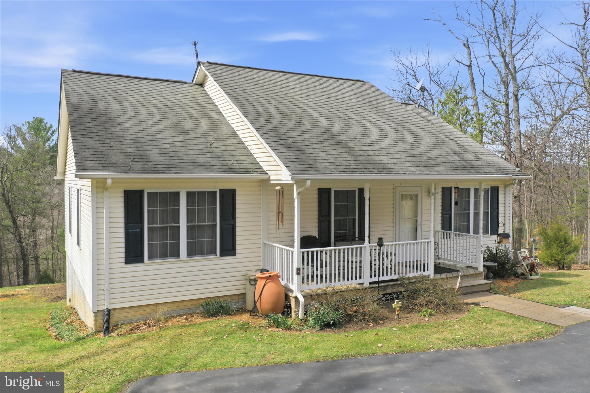 1158 Drummer Hill Road Front Royal, VA 22630 - Photo 28 of 36 a view of a house with a yard and sitting area