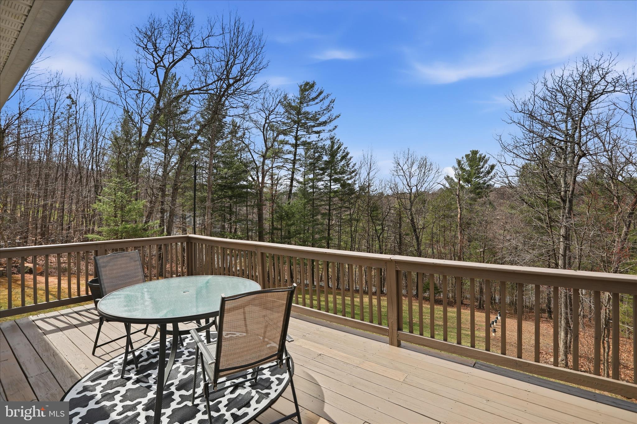 1158 Drummer Hill Road Front Royal, VA 22630 - Photo 4 of 36 a view of a chairs and table on the deck