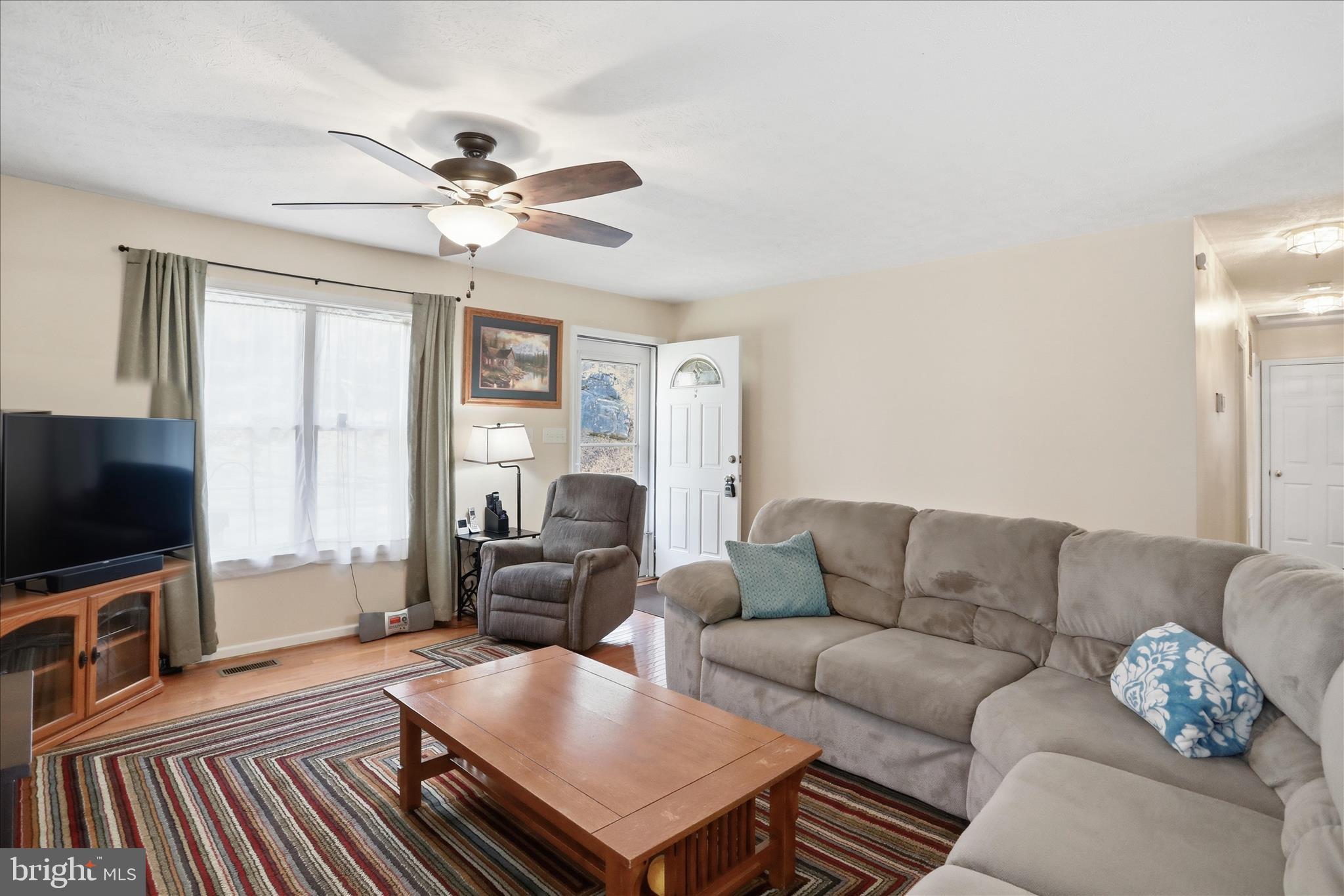 1158 Drummer Hill Road Front Royal, VA 22630 - Photo 5 of 36 a living room with furniture and a flat screen tv