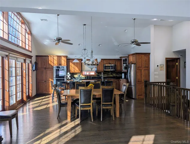 a view of a dining area with furniture window and wooden floor