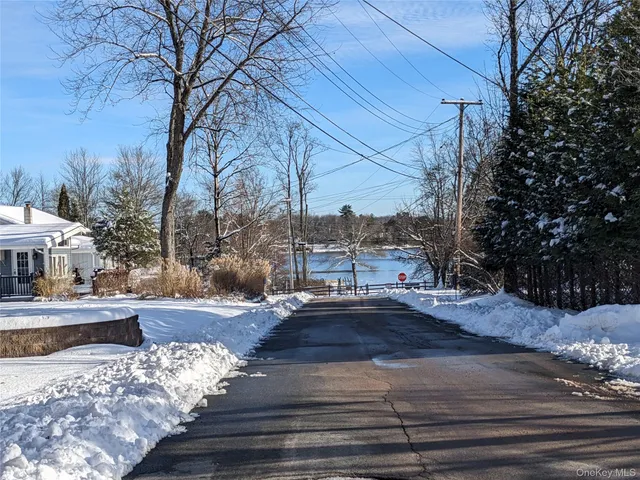 a street view with residential house and trees around