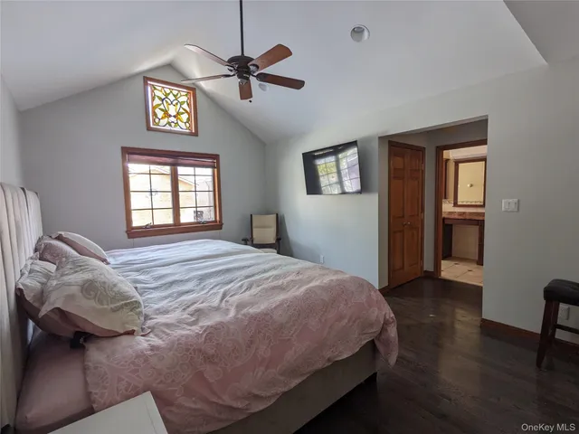 a view of a hallway and a livingroom with furniture