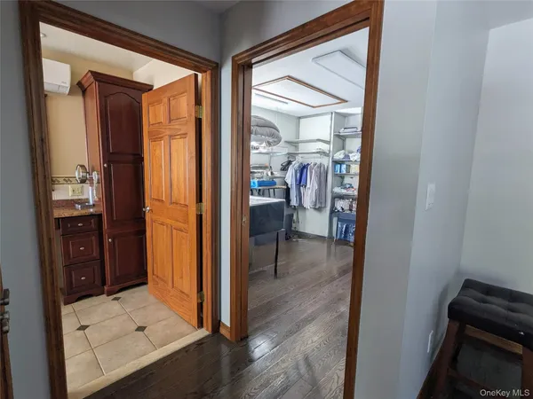 a spacious bathroom with a granite countertop tub sink and mirror