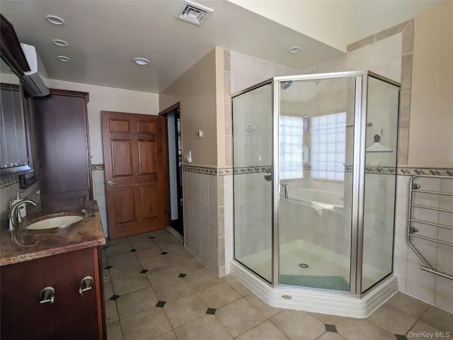 a view of a white house with a yard covered in snow