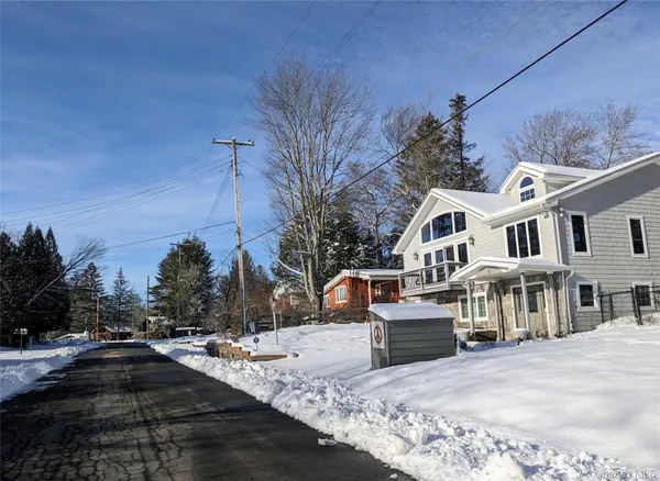 a view of a lake with a bench and lake view