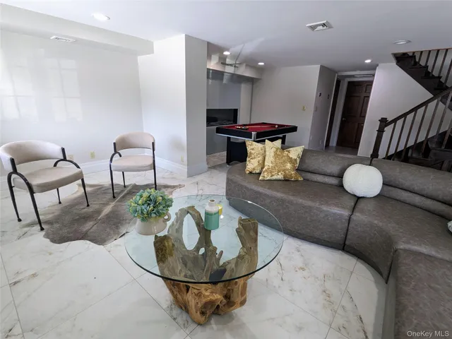 a living room with furniture and window