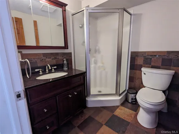 a bedroom with two beds and a window