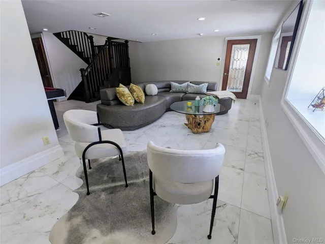 a bedroom with bed and window