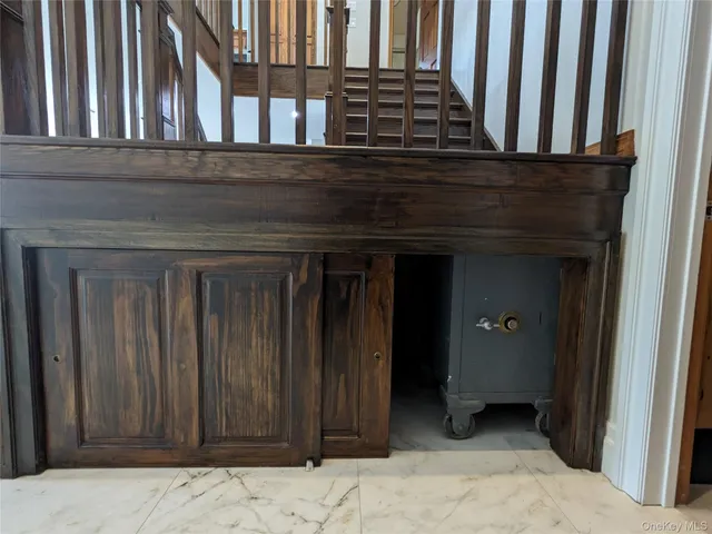 a view of a dining room with furniture wooden floor and chandelier