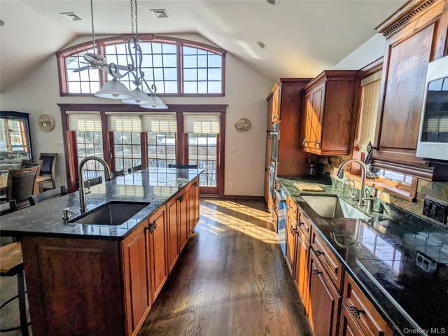 a kitchen with counter top space a sink and cabinets
