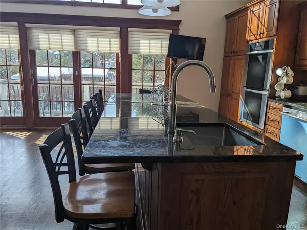 a view of a livingroom with furniture window and wooden floor