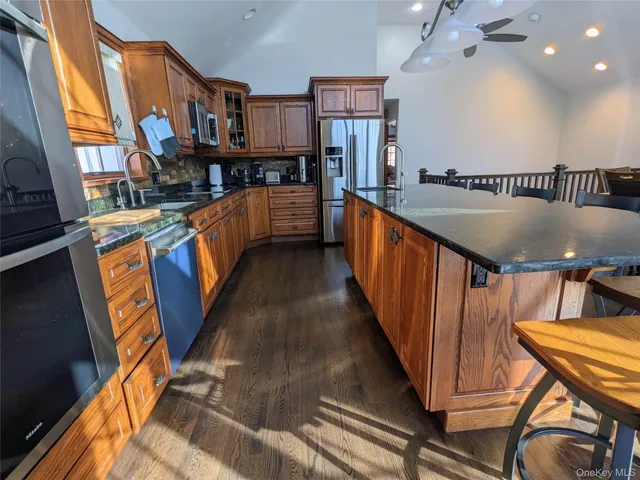 a view of a kitchen with furniture and staircase