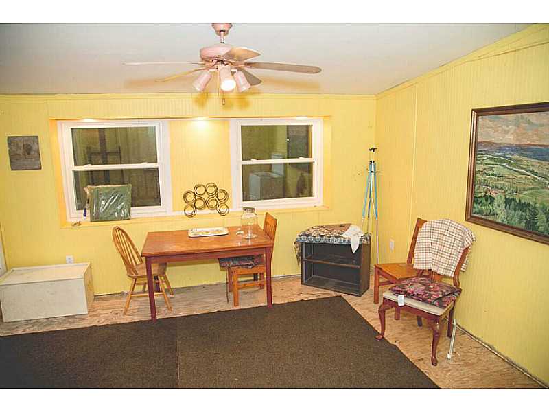 42 Anthony Road Foster, RI 02825 - Photo 22 of 25 Porch. Enclosed three season room.