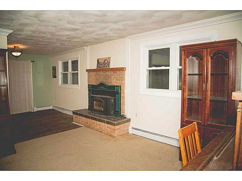 42 Anthony Road Foster, RI 02825 - Photo 10 of 25 Living Room. Heat the home with this great wood burning insert.