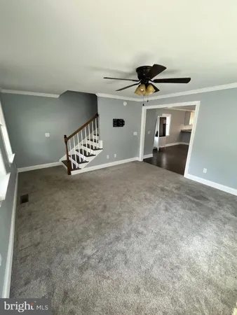 a view of an empty room and glass door