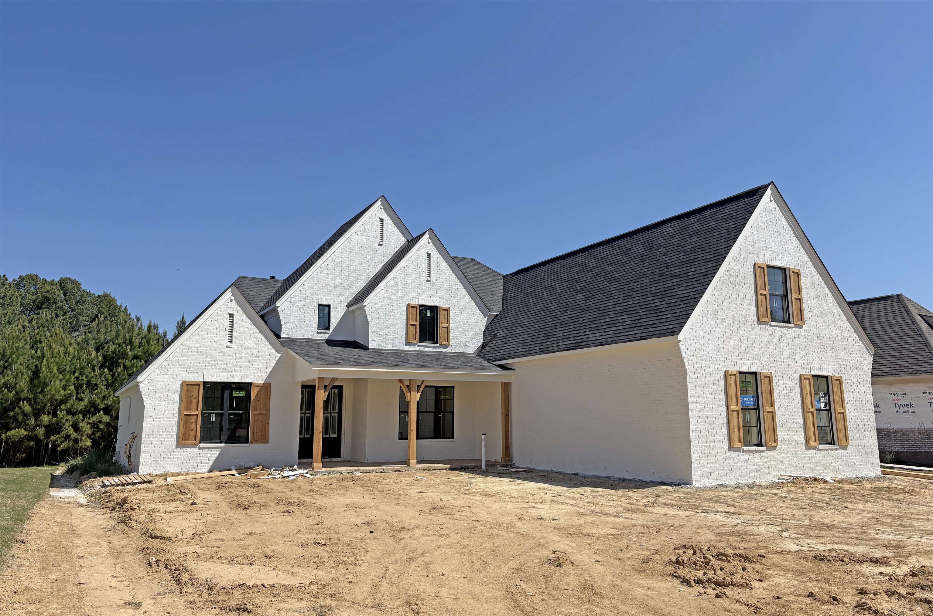 336 Rolling Grove Boulevard Collierville, TN 38017 - Photo 1 of 5 a view of a white house with a yard