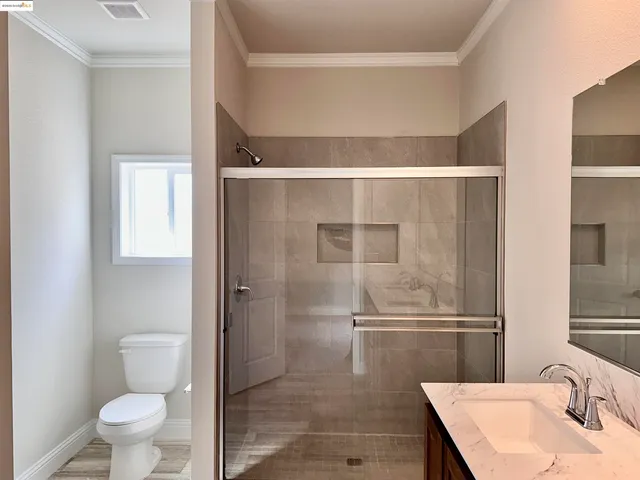 a view of a bedroom from a hallway