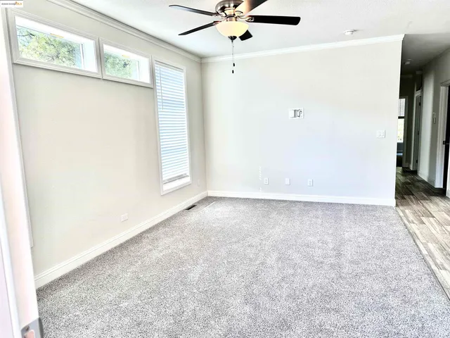 a view of a house with wooden fence