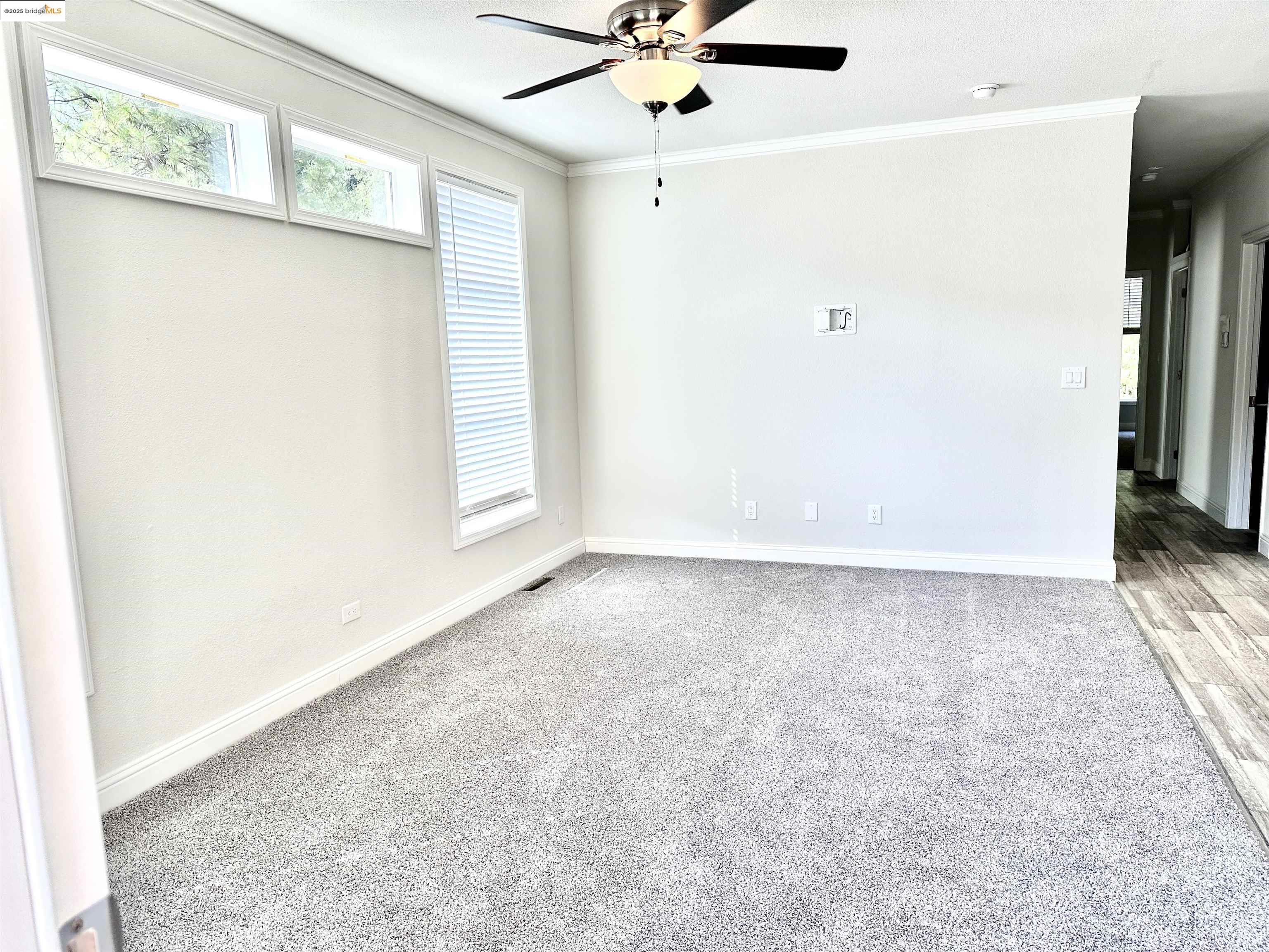 18330 Wards Ferry Road, Unit 25 Sonora, CA 95370 - Photo 14 of 22 an empty room with a ceiling fan and a window
