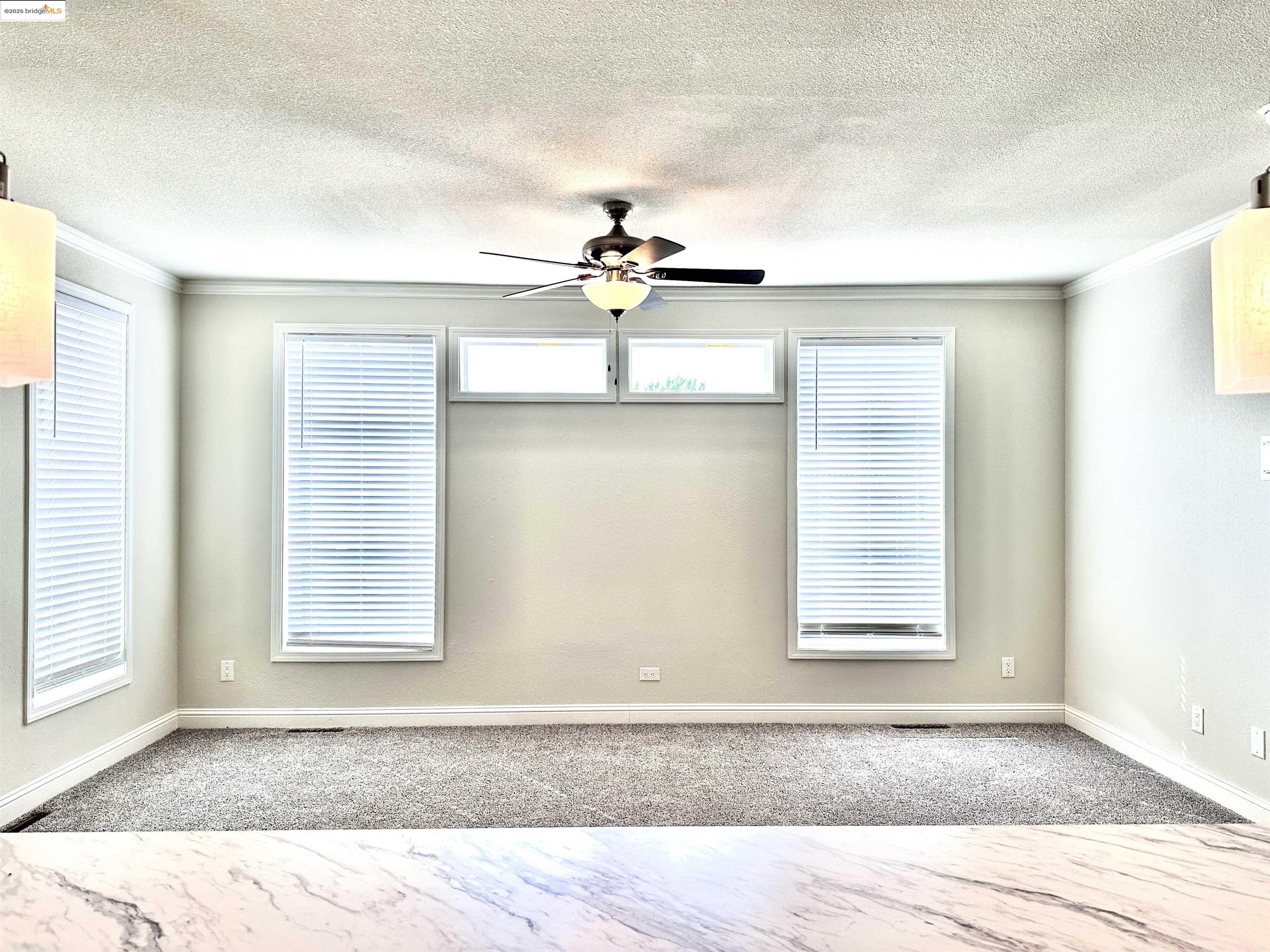 18330 Wards Ferry Road, Unit 25 Sonora, CA 95370 - Photo 15 of 22 a view of a livingroom with a ceiling fan and window