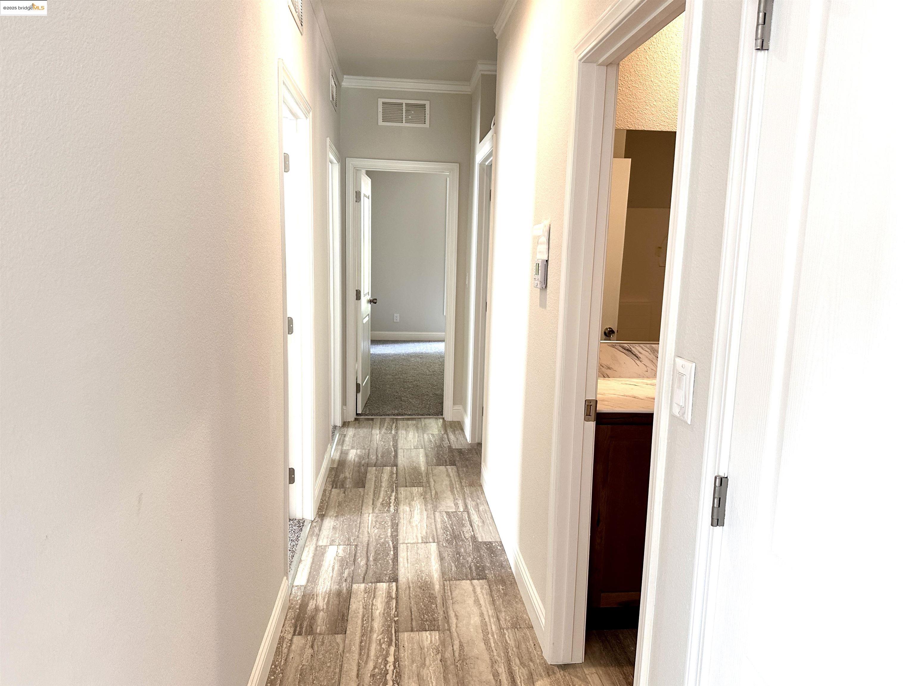 18330 Wards Ferry Road, Unit 25 Sonora, CA 95370 - Photo 16 of 22 a view of a bedroom from a hallway