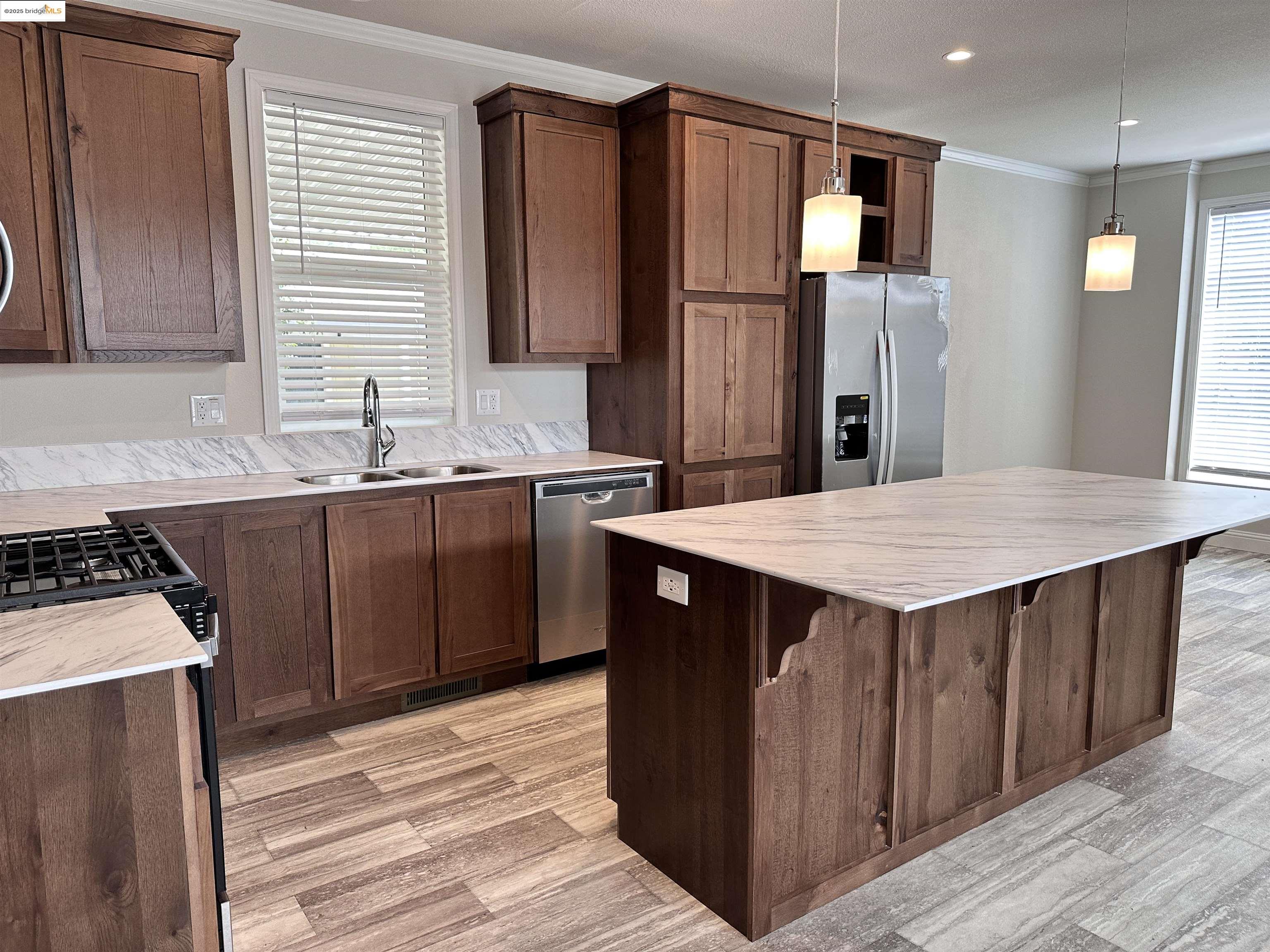 18330 Wards Ferry Road, Unit 25 Sonora, CA 95370 - Photo 2 of 22 a kitchen with stainless steel appliances a sink stove and refrigerator