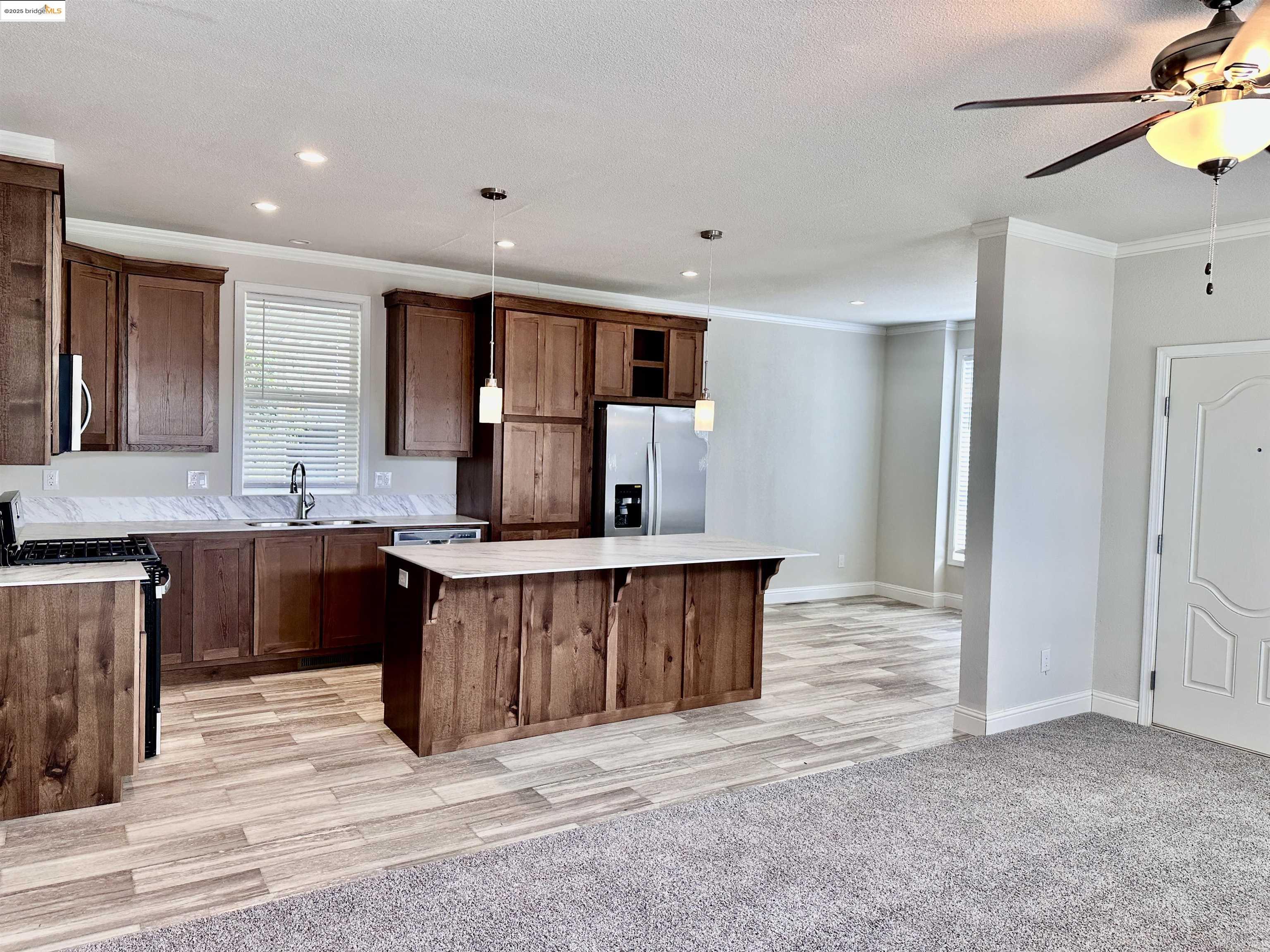 18330 Wards Ferry Road, Unit 25 Sonora, CA 95370 - Photo 3 of 22 a kitchen with stainless steel appliances granite countertop a sink stove and refrigerator