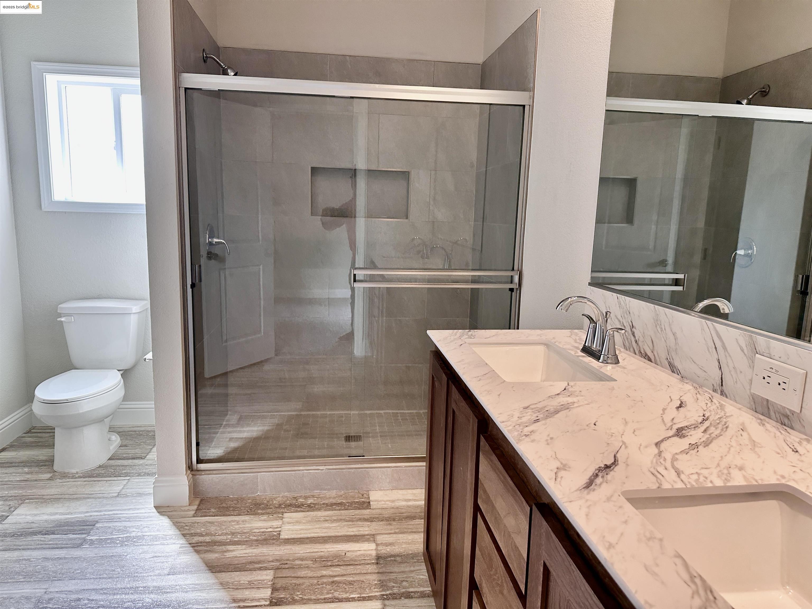 18330 Wards Ferry Road, Unit 25 Sonora, CA 95370 - Photo 7 of 22 a bathroom with a granite countertop sink a toilet and shower