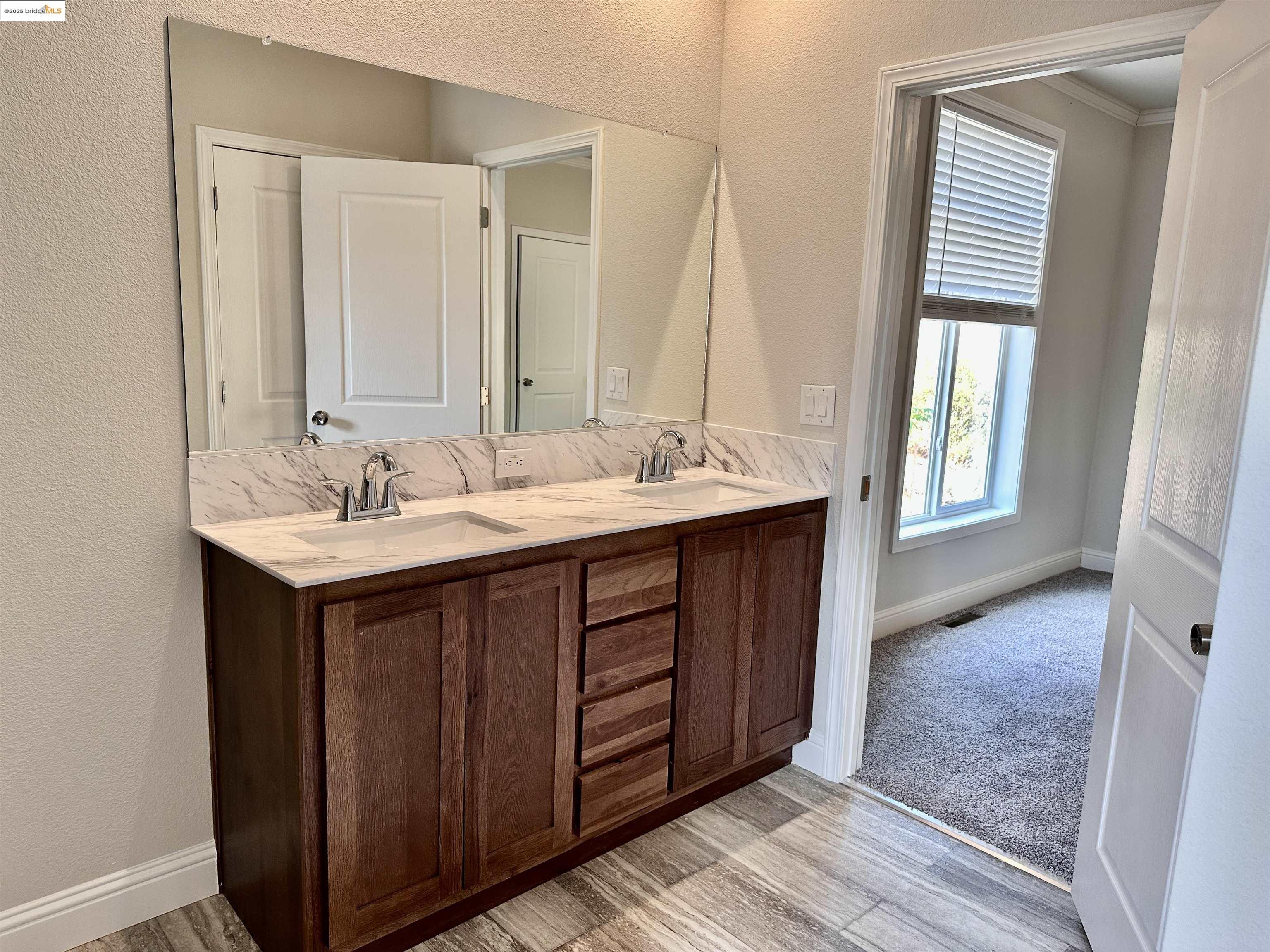 18330 Wards Ferry Road, Unit 25 Sonora, CA 95370 - Photo 8 of 22 a bathroom with a double vanity sink and a mirror