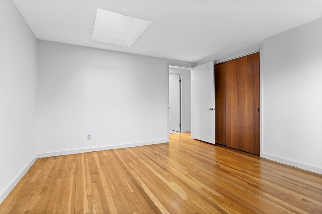 11 Patterson Road Lexington, MA 02421 - Photo 17 of 37 a view of an empty room with wooden floor