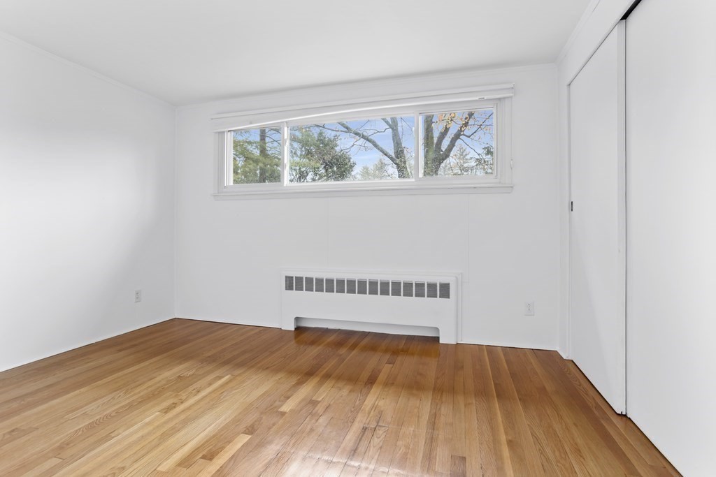11 Patterson Road Lexington, MA 02421 - Photo 22 of 37 a view of a room with wooden floor and window