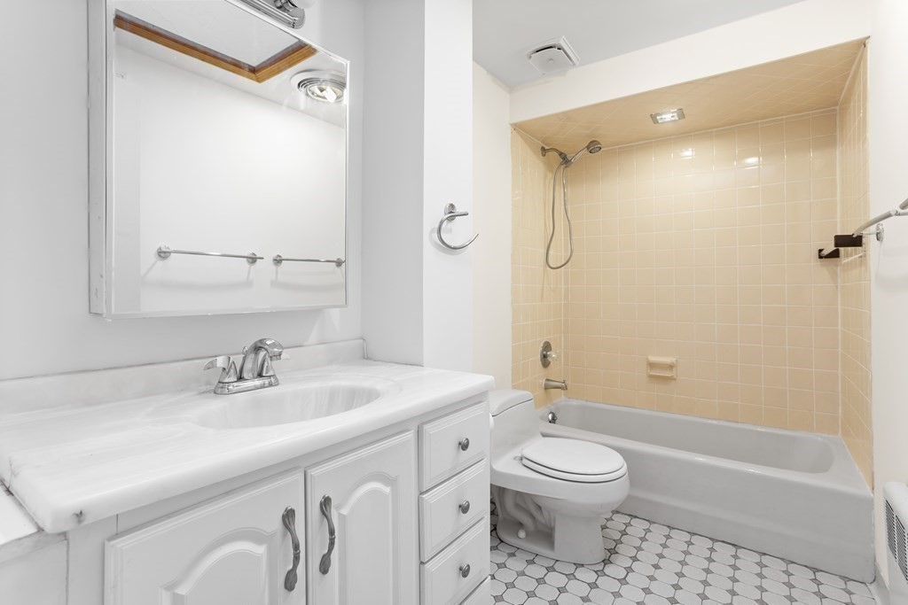 11 Patterson Road Lexington, MA 02421 - Photo 23 of 37 a bathroom with a sink a toilet and shower