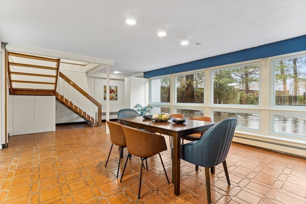 11 Patterson Road Lexington, MA 02421 - Photo 24 of 37 a dining room with furniture and floor to ceiling windows