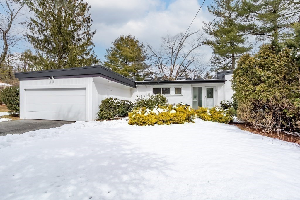 11 Patterson Road Lexington, MA 02421 - Photo 35 of 37 a front view of a house with a yard and garage