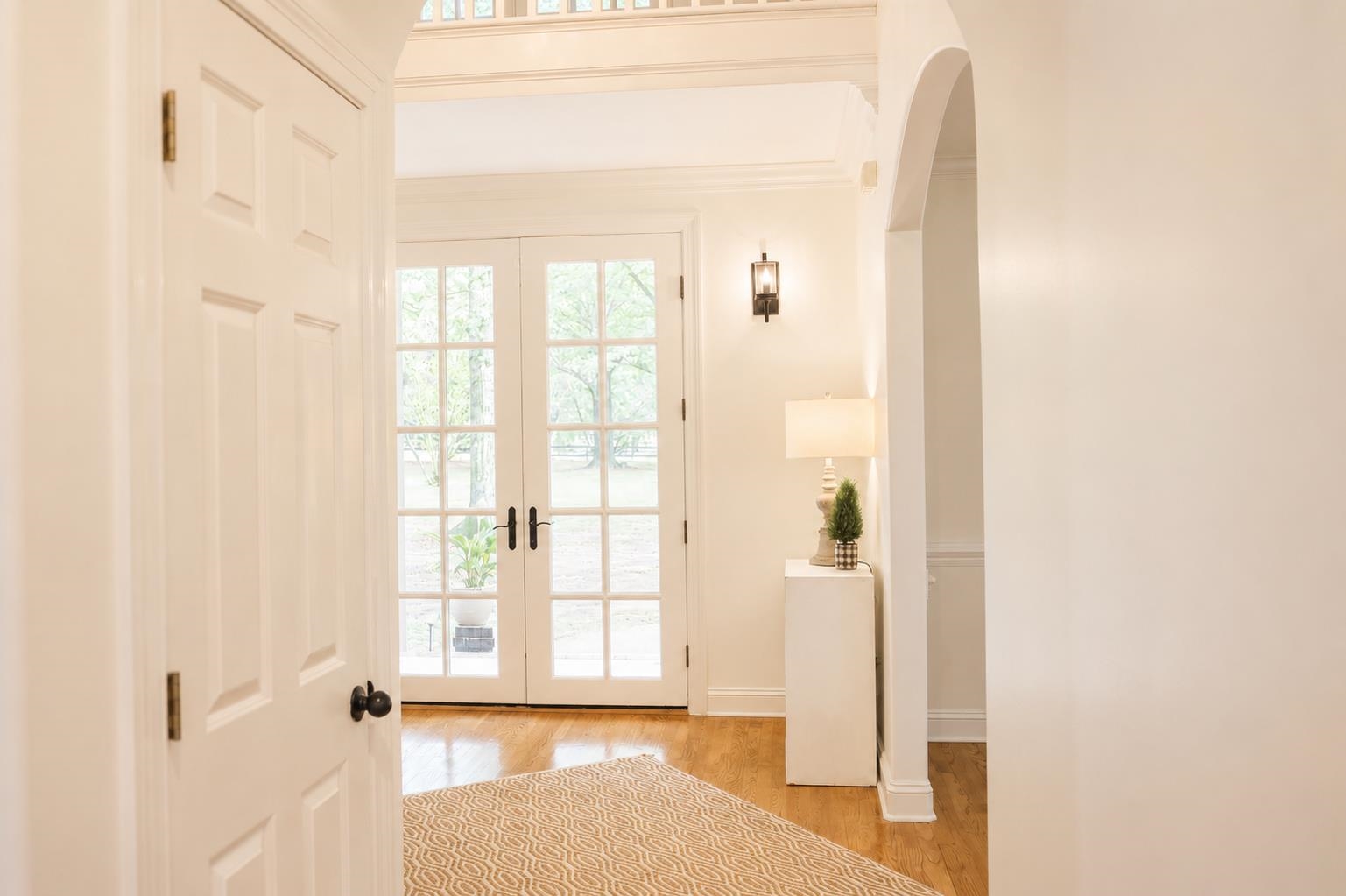 565 Schaeffer Loop Eads, TN 38028 - Photo 6 of 40 a view of a hallway with wooden floor and a dining room