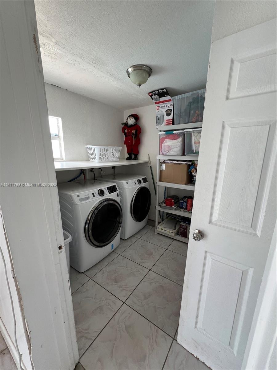 13360 Southwest 43rd Street Miami, FL 33175 - Photo 12 of 12 a utility room with dryer and washer