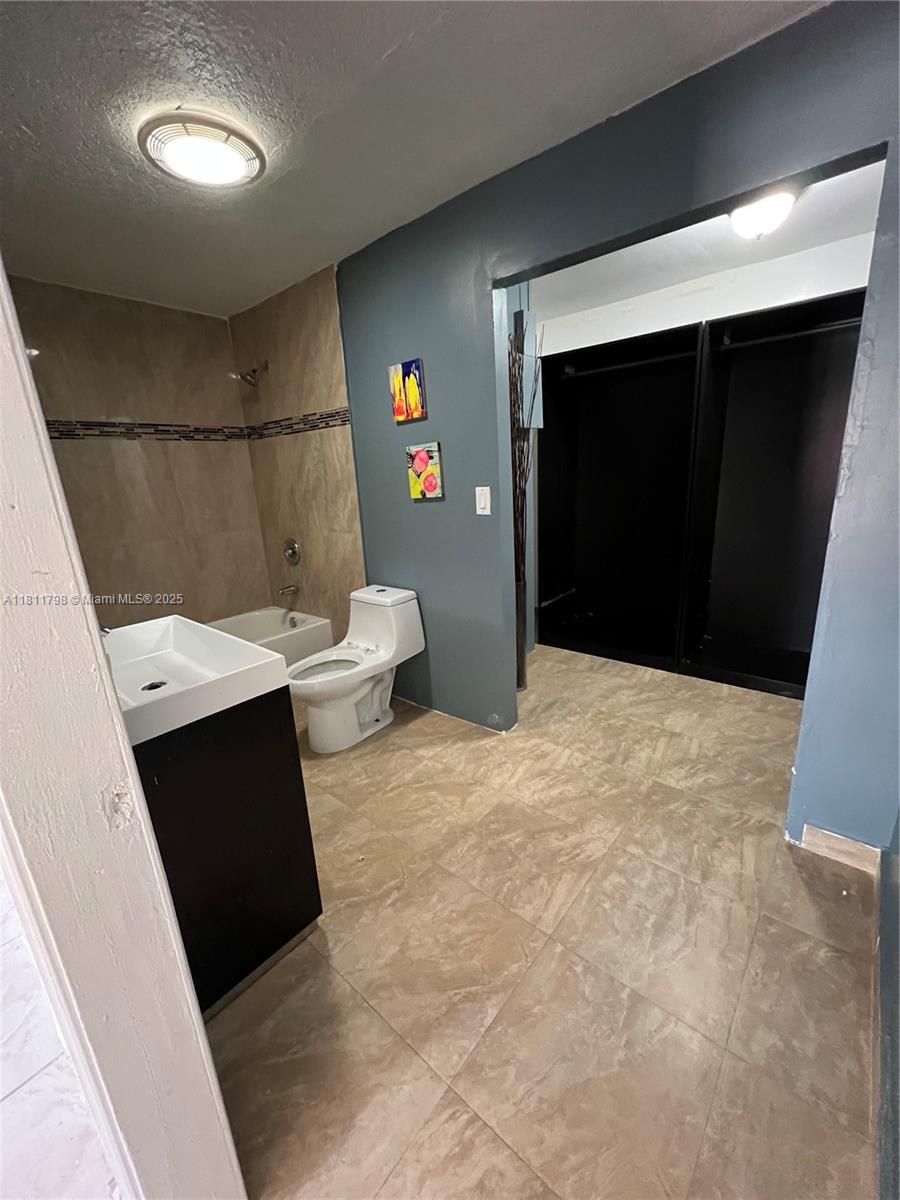 13360 Southwest 43rd Street Miami, FL 33175 - Photo 9 of 12 a bathroom with a sink and a toilet